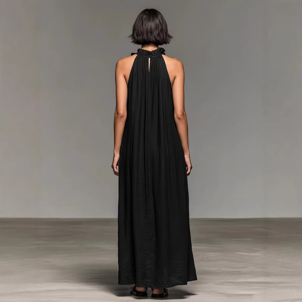 Black halter neck maxi dress with back keyhole detail, minimalist style