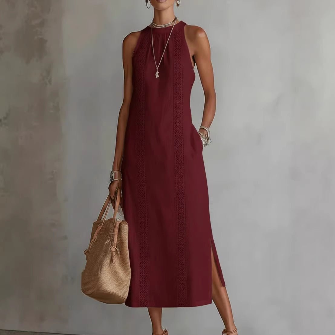 Burgundy sleeveless midi dress with lace trim, side slit, and pocket, styled with woven bag and layered necklace