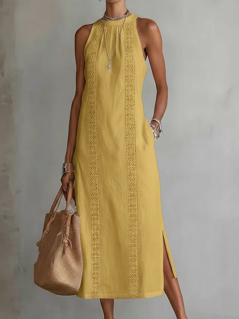Yellow sleeveless midi dress with lace trim, side slit, and halter neckline, paired with woven tote bag